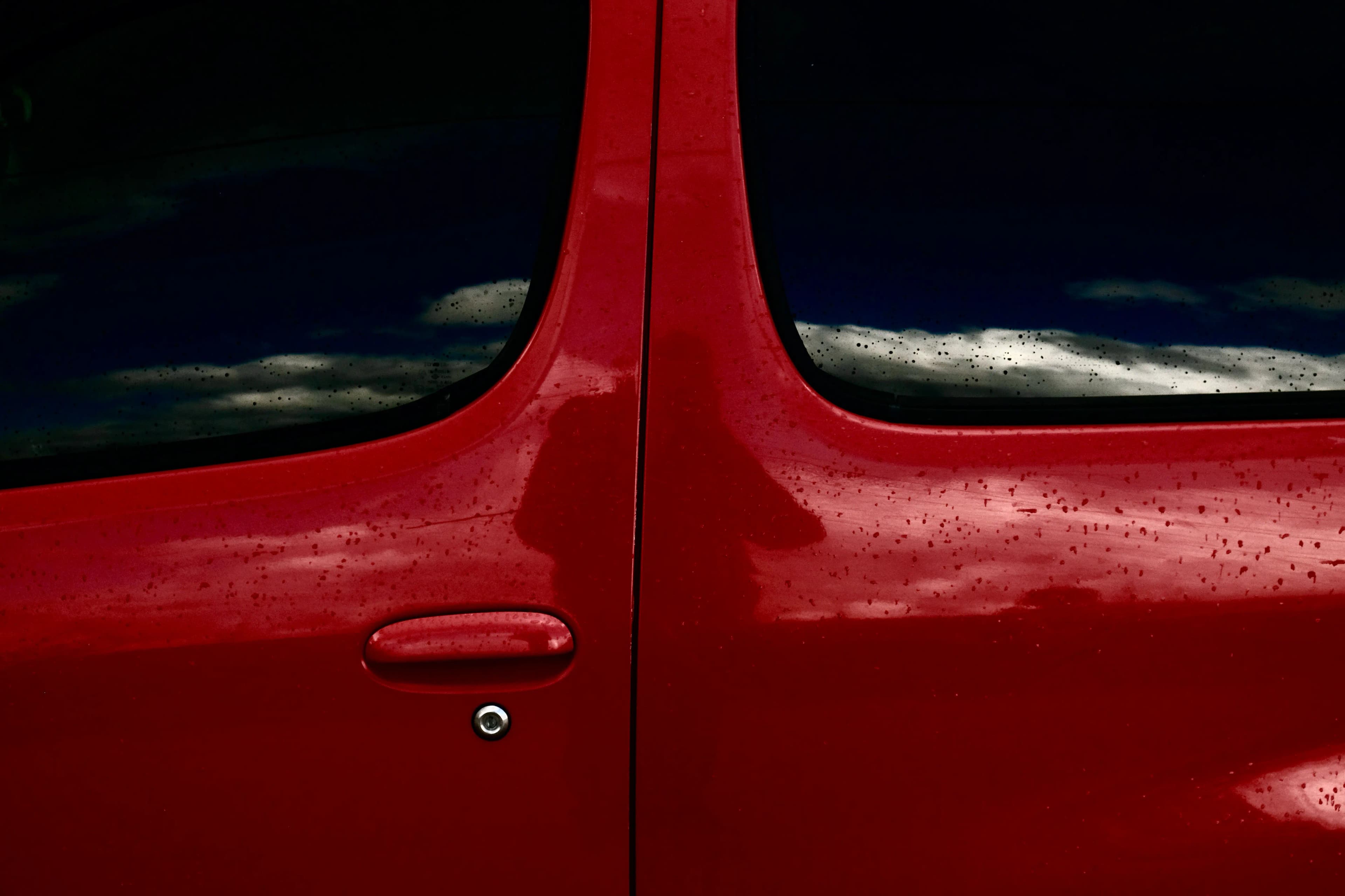 Background image of a red car door